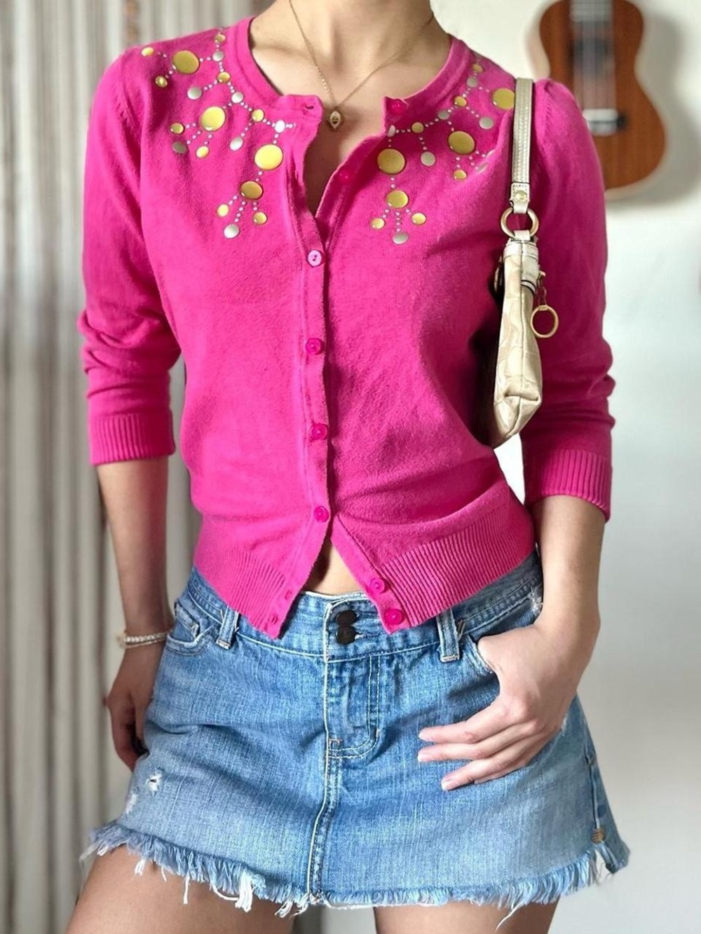 hot pink cardigan with gold and silver embellishments